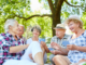 Group of seniors outdoors talking and comparing Medicare coverage options