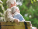 Older couple sitting together outdoors while discussing retirement and Medicare planning